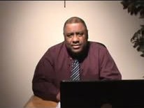 Roy Hanner at a desk with a laptop, working with a customer
